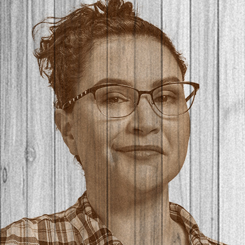 Dark-haired women with glasses facing camera, transparent on wooden background