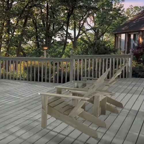 A deck using gray stain with chairs on it